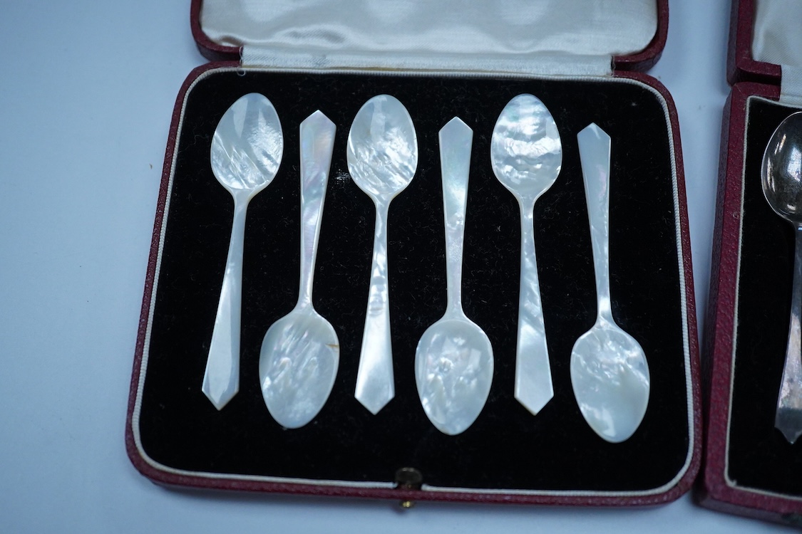 A cased set of six silver gilt and enamel coffee spoons, Adie Brothers, Birmingham, 1966, together with two other cased sets of coffee spoons including a mother of pearl set and a silver set.
